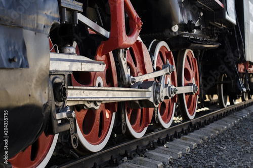 large red wheels of a locomotive