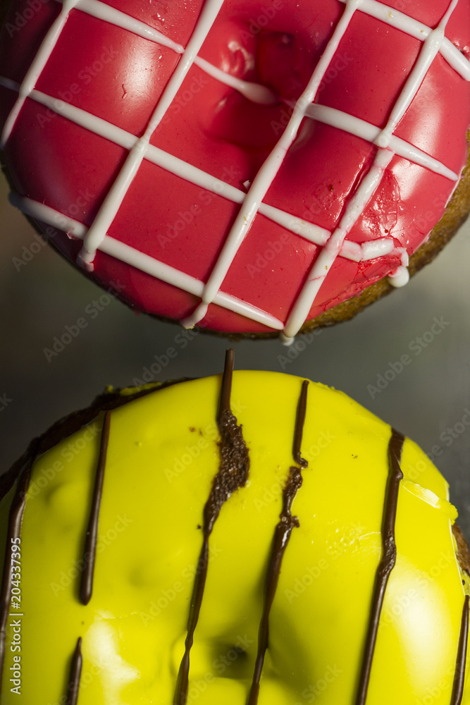Two donuts. Pink and Yellow Two donuts. Pink and Yellow