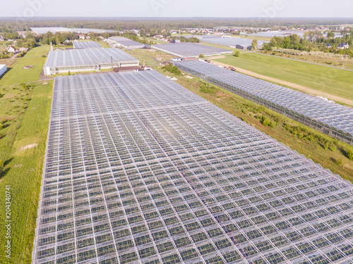 Aerial view of glass greenhouses in the fields of Poland 