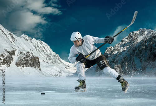 Wallpaper Mural Ice hockey player in action outdoor around mountains Torontodigital.ca