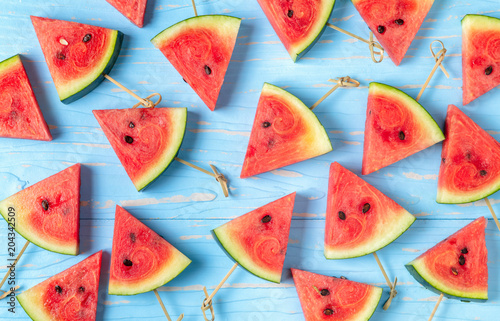 Watermelon slice on a blue rustic wood