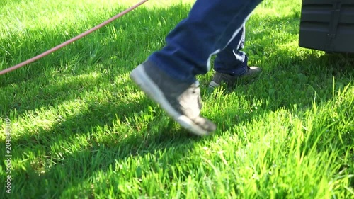 Lawn Mower is mowing the lawn