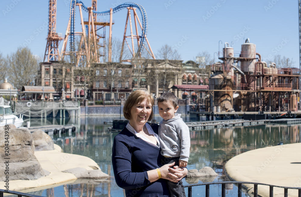 Little boy with his grandmother at the amusement park