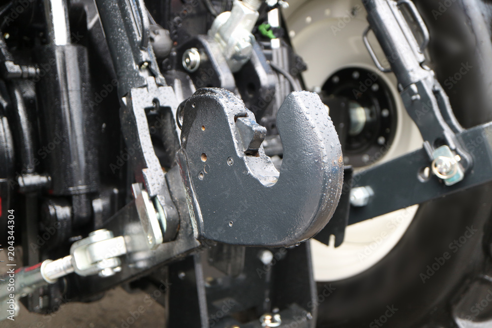 Obraz premium head of the tractor's hydraulic coupling unit with a lock