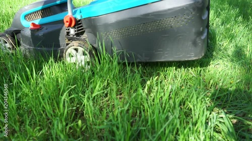 Lawn Mower is mowing the lawn
