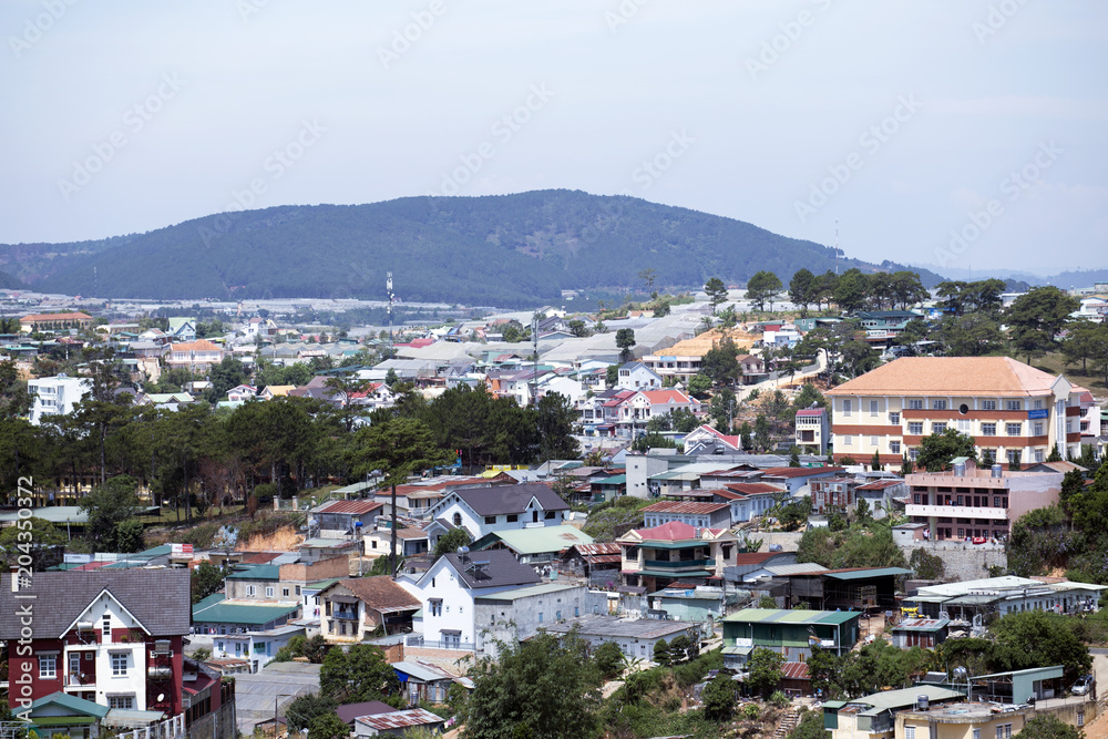 Top view Dalat city with bluesky and clouds in the hill, Dalat Vietnam. Vacation, holiday concept.