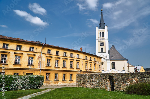 A historic church with a bell tower in the city of Vidnava in the Czech Republic. photo