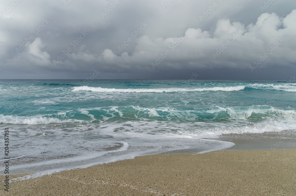 storm on the Atlantic coast, beach patch, waves, foam, low clouds over the ocean, Varadero  Cuba