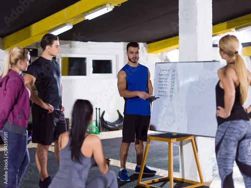 athletes getting instructions from trainer photo