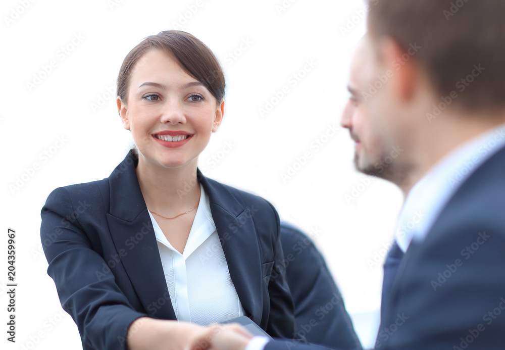 closeup of business woman shaking hands with her colleague. closeup of business woman shaking hands with her colleague.