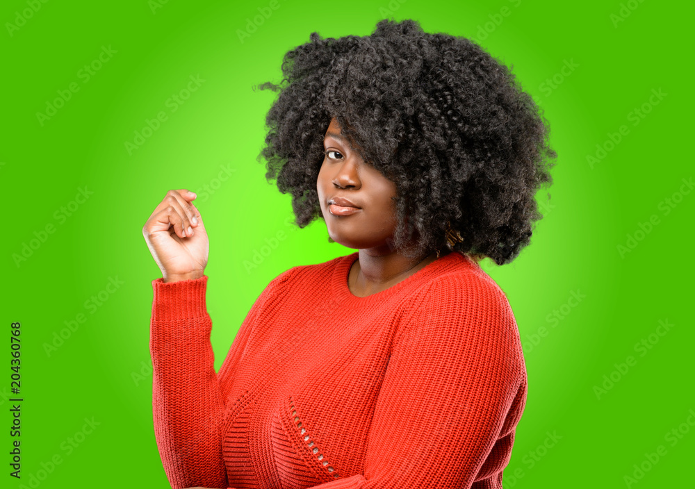 Beautiful african woman with crossed arms confident and serious