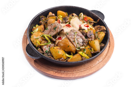 Meat hot frying pan with potatoes, vegetables