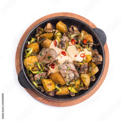 Meat hot frying pan with potatoes, vegetables