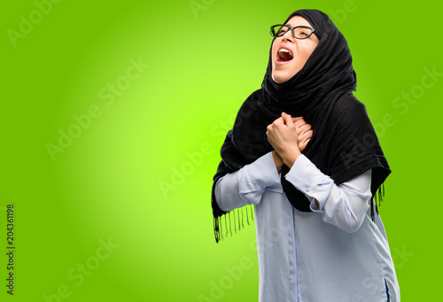 Young arab woman wearing hijab happy and excited celebrating victory expressing big success, power, energy and positive emotions. Celebrates new job joyful © Krakenimages.com