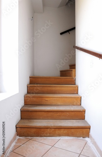 Interior with wooden staircase during renovation. Architecture background.