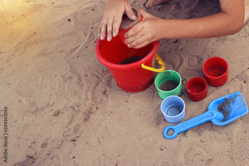 child playing with toys on the beach child playing with toys on the beach