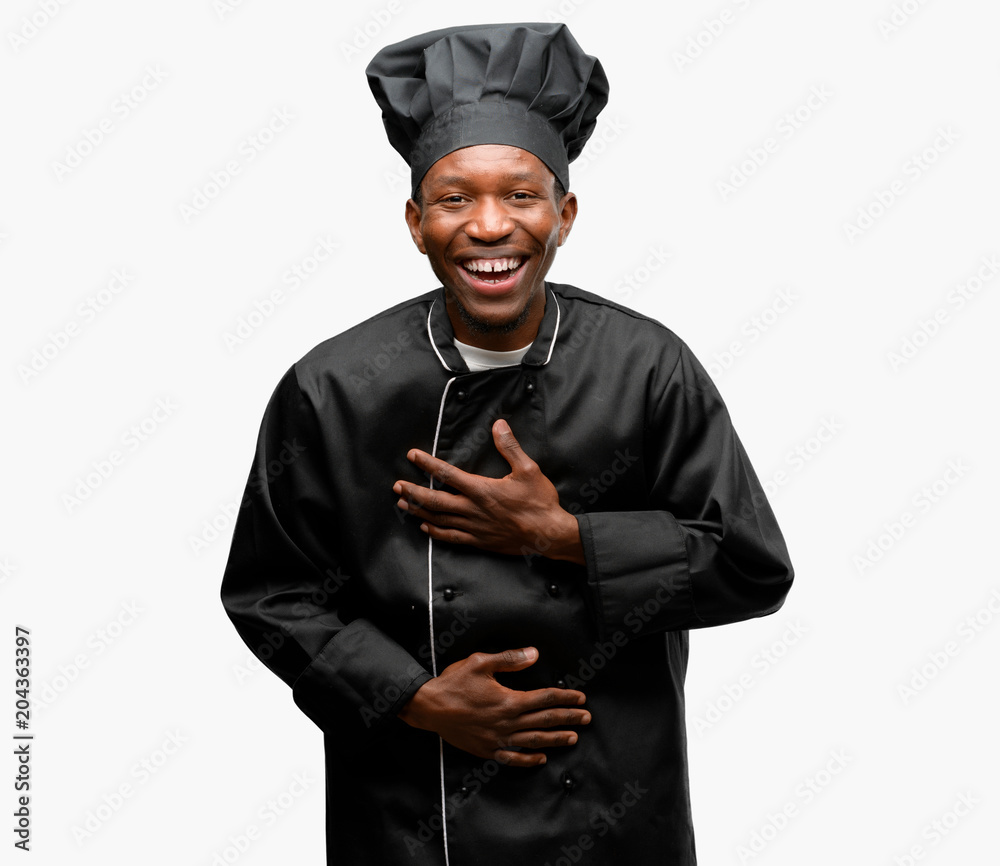 Young black cook wearing chef hat 
