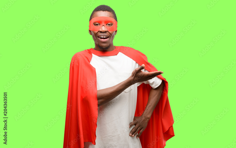 African black super hero man holding something in empty hand African black super hero man holding something in empty hand
