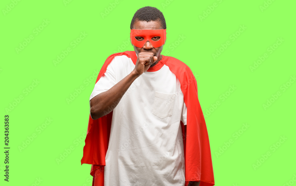 Obraz premium African black super hero man sick and coughing, suffering asthma or bronchitis, medicine concept