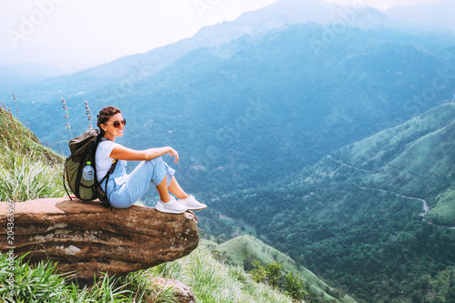 Woman enjoy with beautiful view on mountains and valley in Ella, Sri Lanka, Little Adam Peak