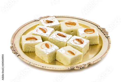 Indian Sweet Food Badam Barfi Also Know As Mithai, barfee, Mawa Barfi, Mava barfi, Almond Sweet, khoya Burfi Indian Popular Sweet Made up of Coconut, Mawa, Milk and Sugar isolated on white background photo