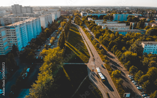 Canvas Print small park at michelangelo street, berlin with some plattenbau buildings in the