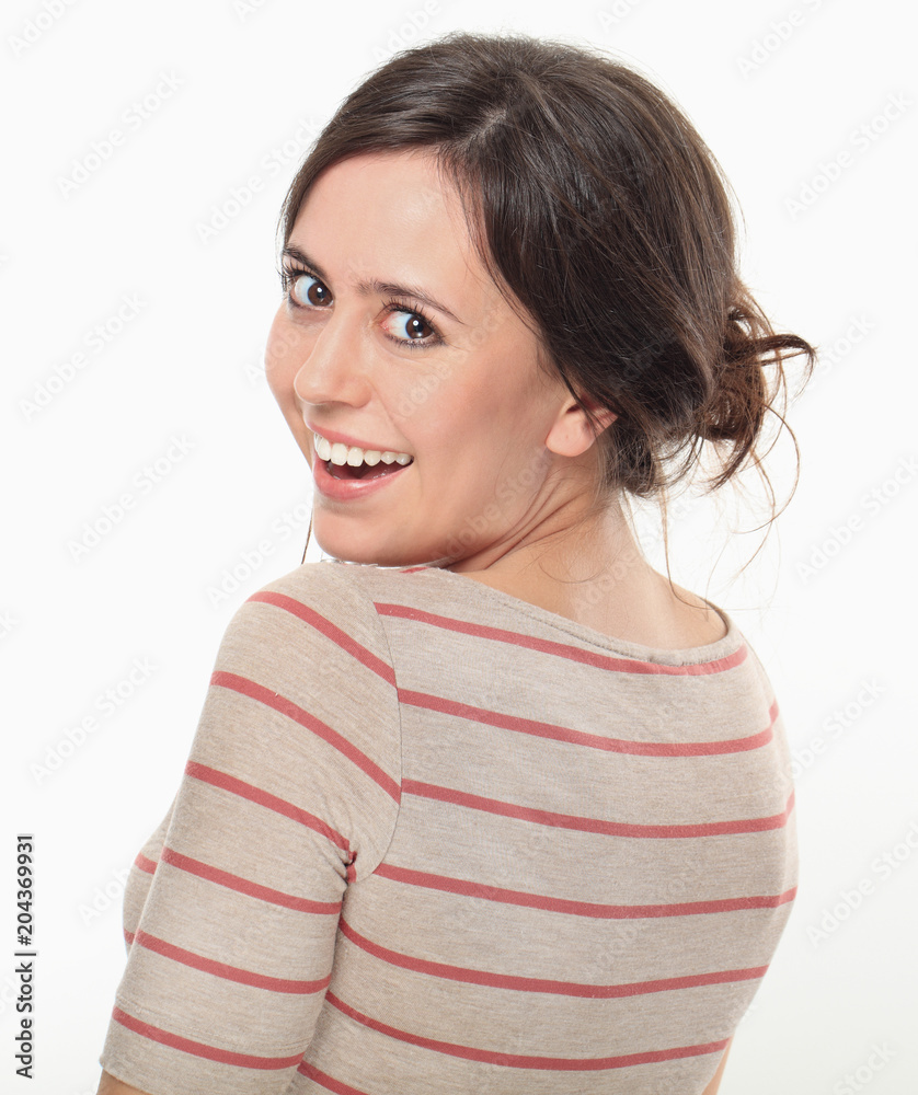 Happy young brunette posing side to camera Happy young brunette posing side to camera