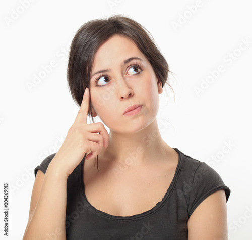 Thoughtful beautiful brunette woman photo