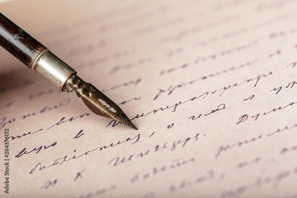 Fototapeta premium Fountain pen on an antique handwritten letter