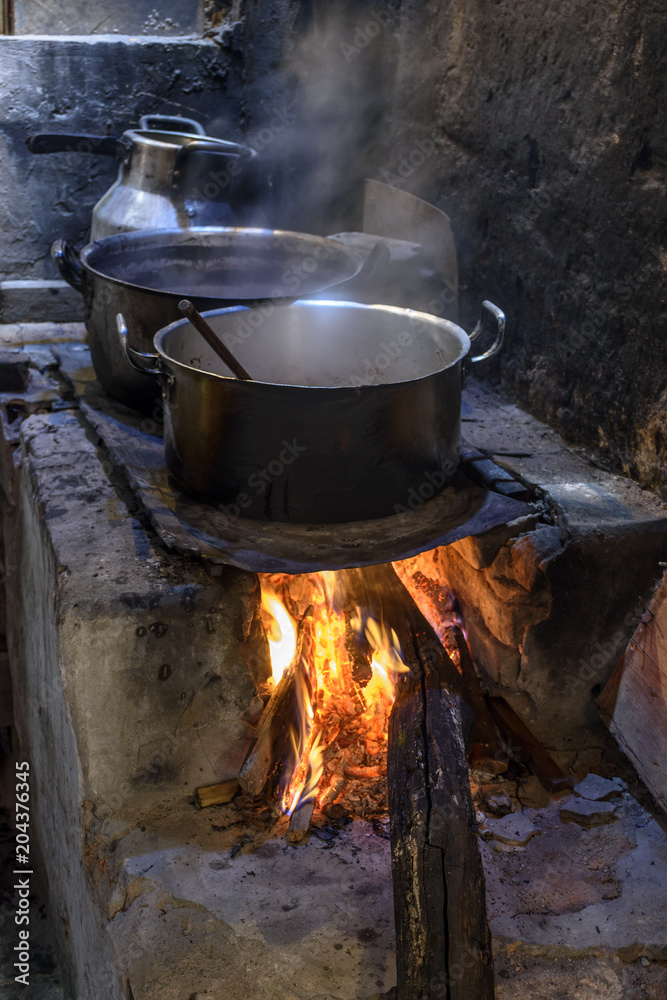 Traditional Brazilian food being prepared on old and popular wood stove Traditional Brazilian food being prepared on old and popular wood stove