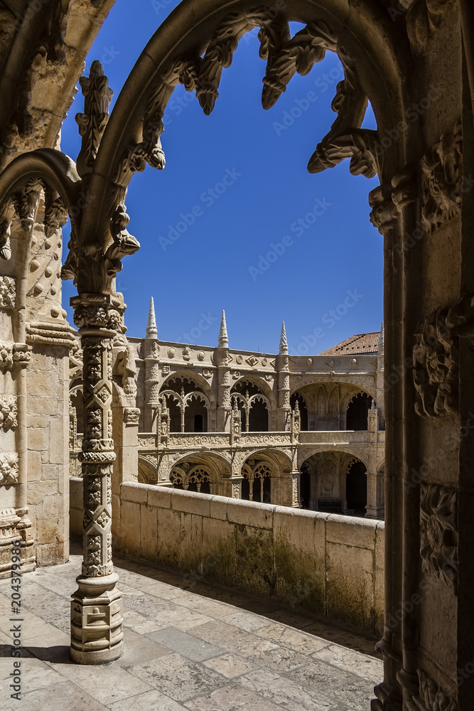 Lisbon, Portugal - June 6, 2013: Cloister of the Jeronimos Monastery or Abbey in Lisbon, Portugal, aka Santa Maria de Belem monastery. UNESCO World Heritage it Masterpiece of the Manueline art.