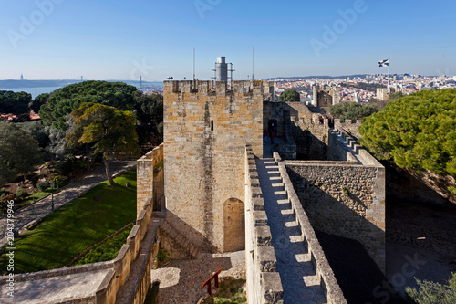Lisbon, Portugal - February 1, 2013: Castelo de Sao Jorge aka Saint George Castle. Barbican structure on the keep entrance and the Ulysses Tower.