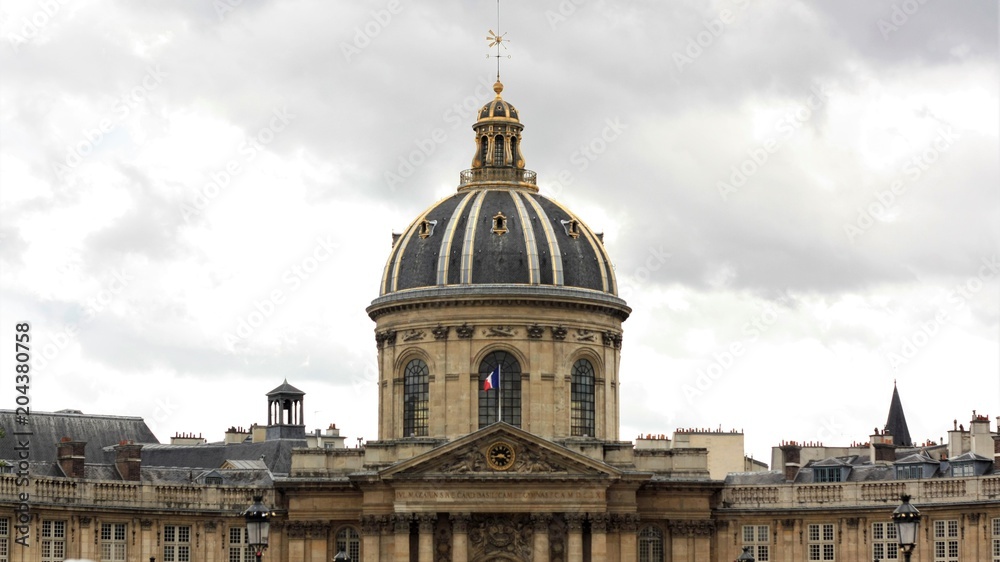 Historical government stone building with symmetrical architecture with a dome on the roof in a European city