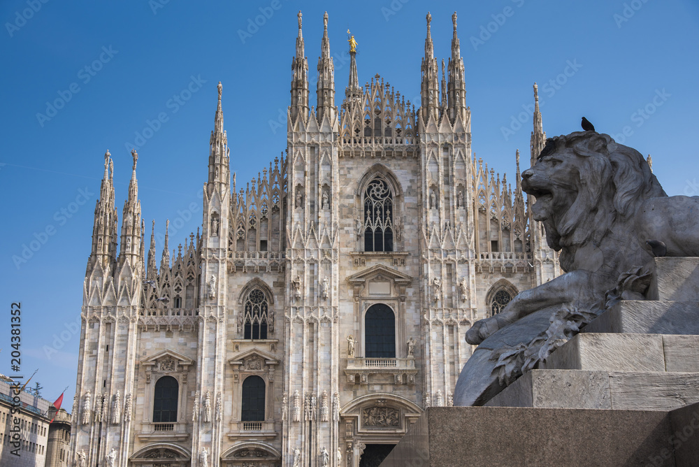 An architecture of Milan Cathedral with a lion statue on momument, the famous landmark, Duomo di Milano, Milan Italy