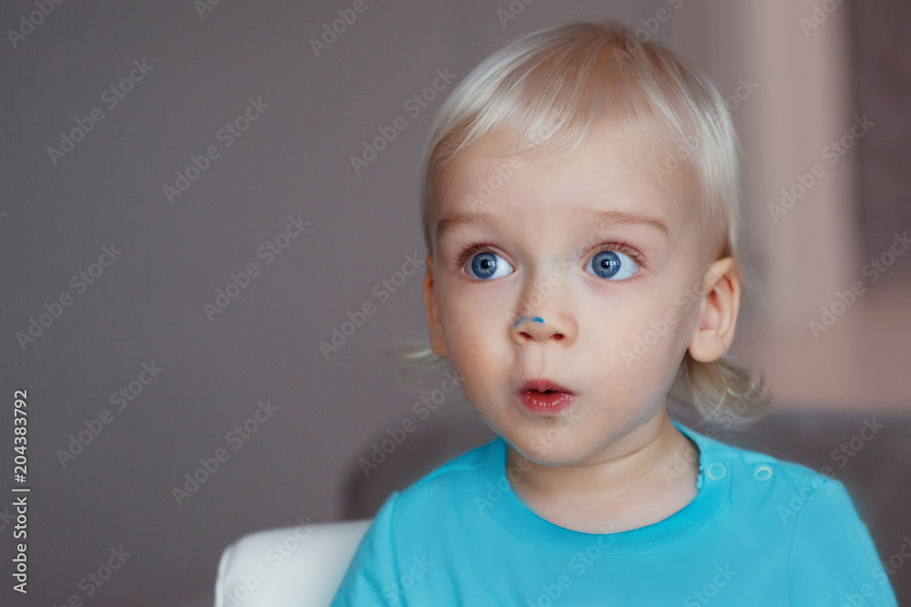 Cute boy with blond hair and blue eyes Cute boy with blond hair and blue eyes