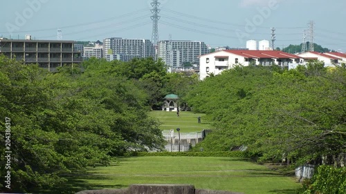 TAMA CITY,  TOKYO,  JAPAN - CIRCA MAY 2018 : Scenery of TAMA NEW TOWN RESIDENTIAL AREA and TAKARANO PARK near TAMA CENTER train station. photo