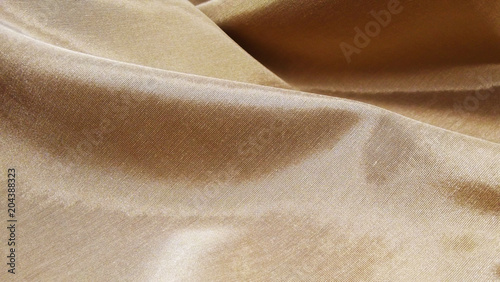 Beautiful brown background made of dense fabric.