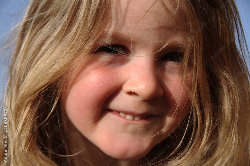 Portrait of cute little blond girl in countryside, summertime Portrait of cute little blond girl in countryside, summertime
