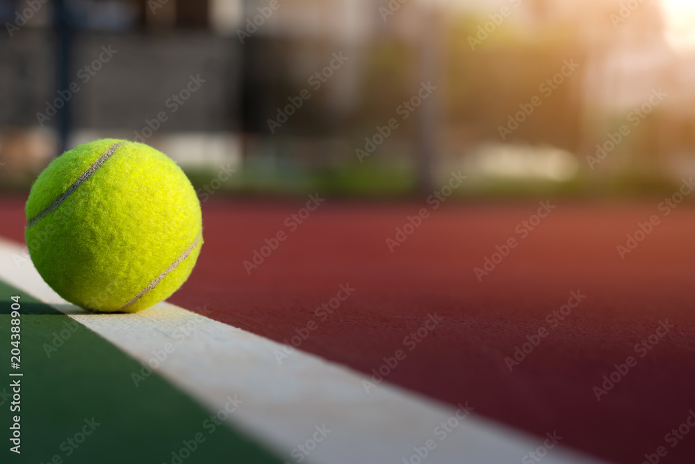 Close up tennis ball on court with copy space
