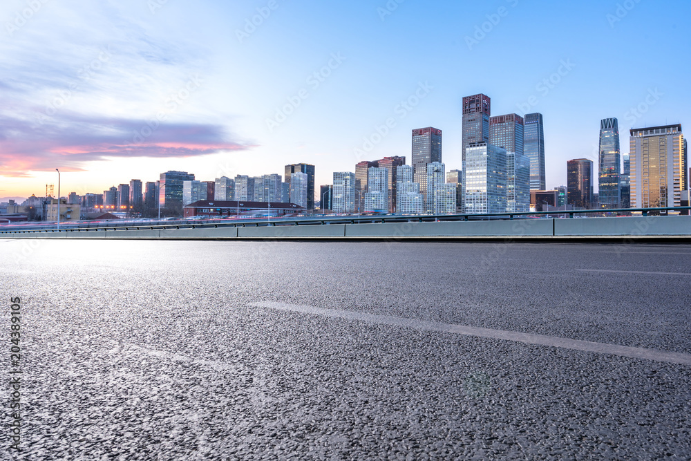 empty asphalt road with modern building