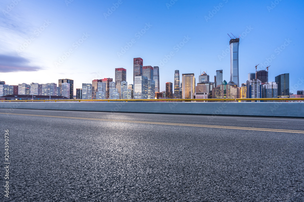 empty road with modern office building empty road with modern office building