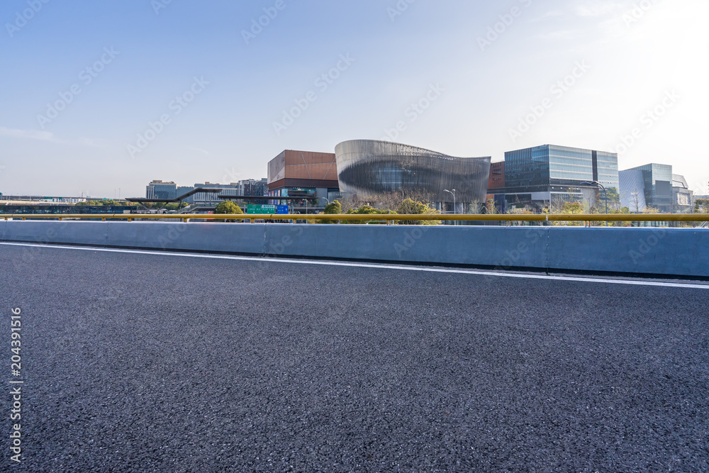 Obraz premium empty road with modern office building