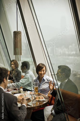 Business colleagues socializing at a restaurant.