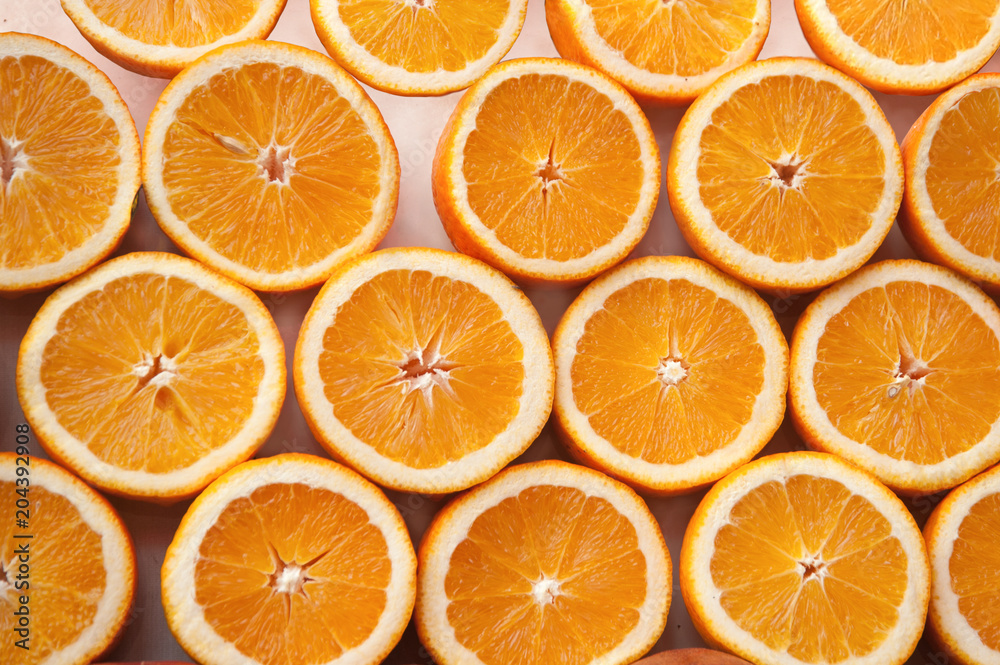 Fresh ripe half cut oranges . Fresh ripe half cut oranges .