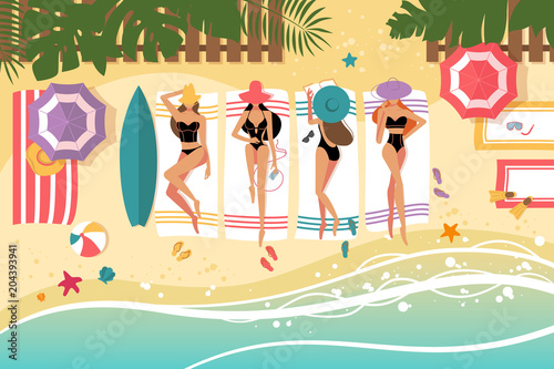 Cute girls sunbathing on beach