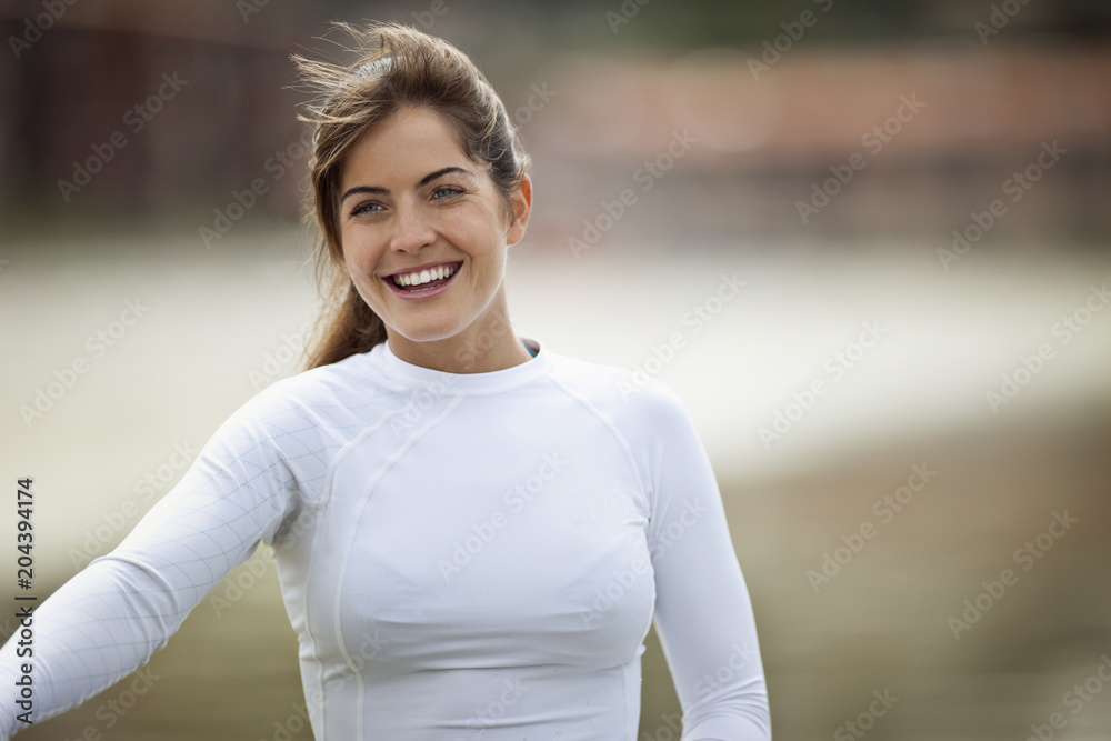 Portrait of attractive young woman in white top at the beach. Portrait of attractive young woman in white top at the beach.