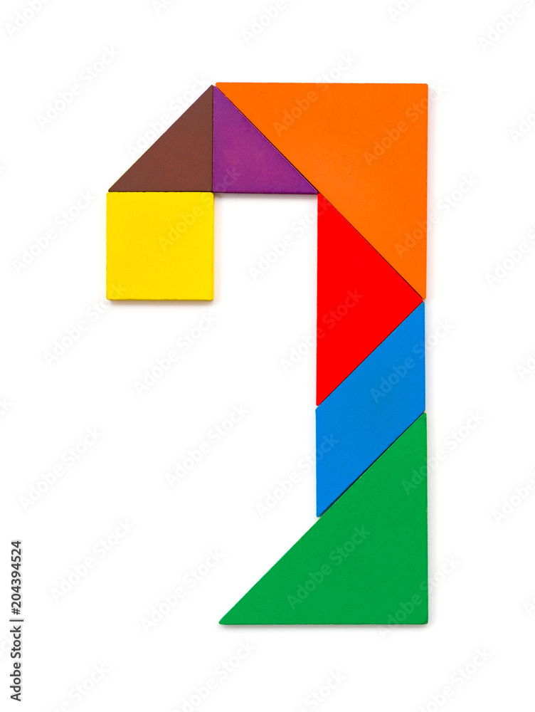 wooden tangram shaped like a number 7 on white wooden tangram shaped like a number 7 on white