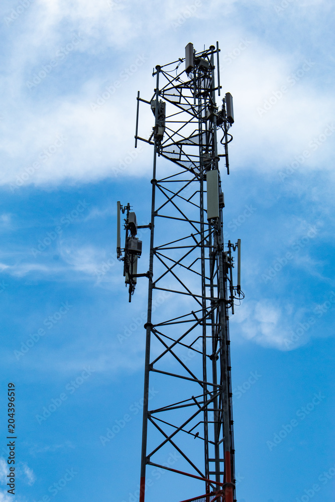 Wave transmission mast, large phone signal with a bright blue sky. Wave transmission mast, large phone signal with a bright blue sky.