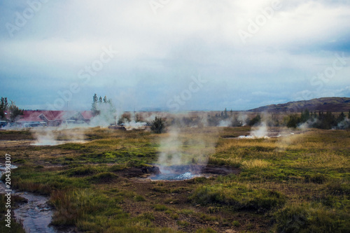 The geothermal field in Haukadalur in Iceland. Neovolcanic zone with geysers and other geothermal features,  popular attraction of Icelandic Golden Circle route.