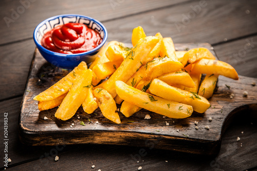 French fries on wooden table photo